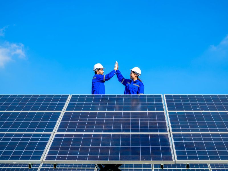 Solar panel station, Engineer installing solar panel at solar energy farm field
